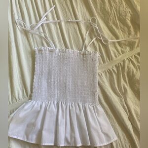 White ribbed tank, flared on the bottom. Worn once, in perfect conditions!